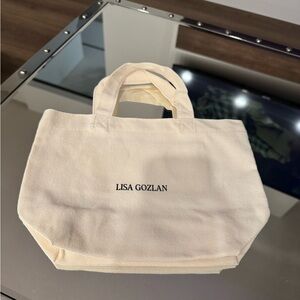 Lisa Gozlan Cream Canvas Tote Bag